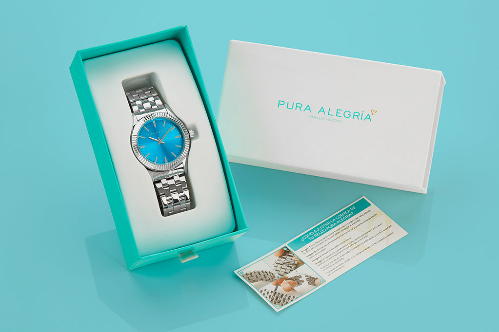 Reloj para mujer plateado con esfera de color turquesa